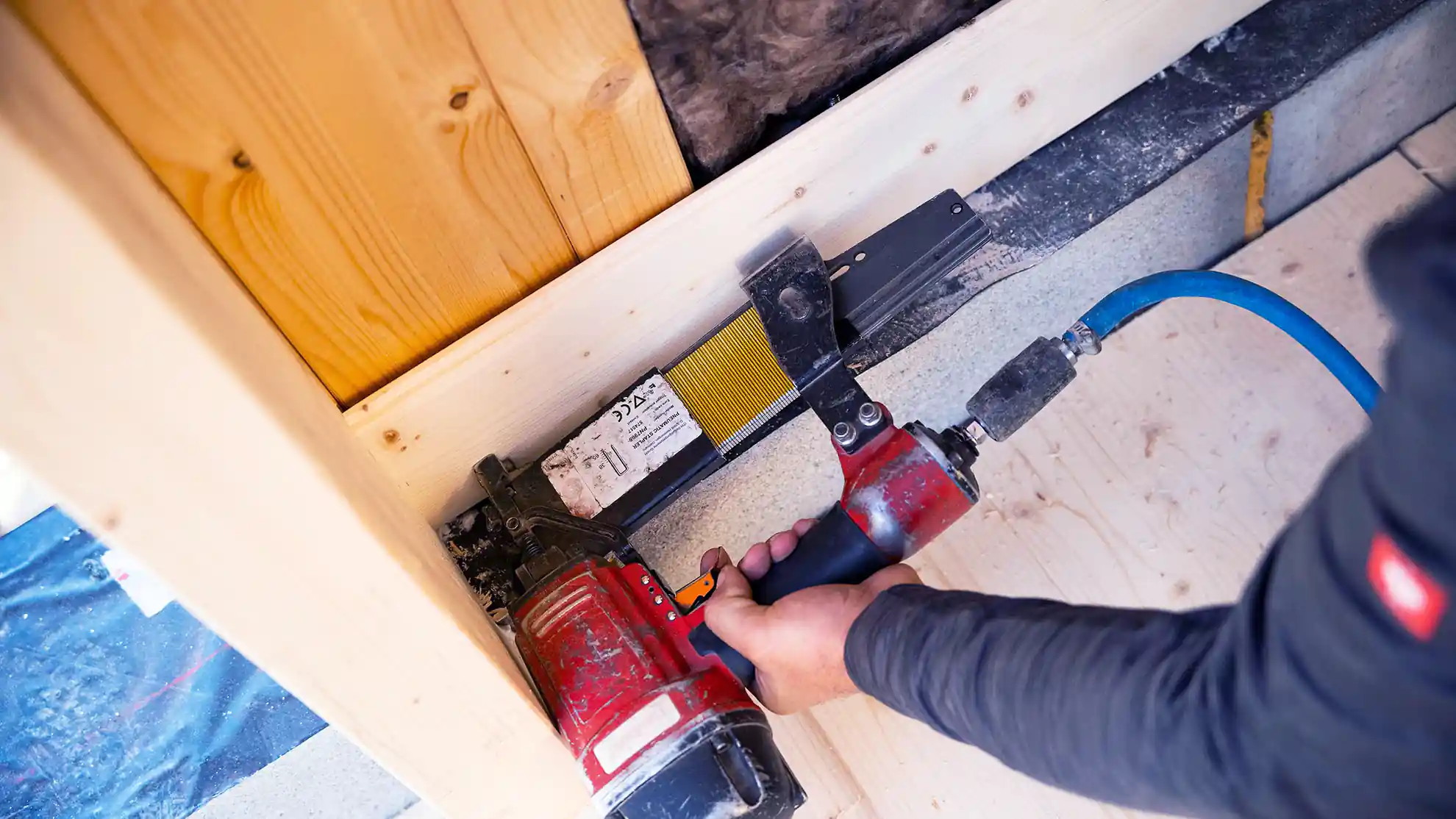 Fastening a nail in wood