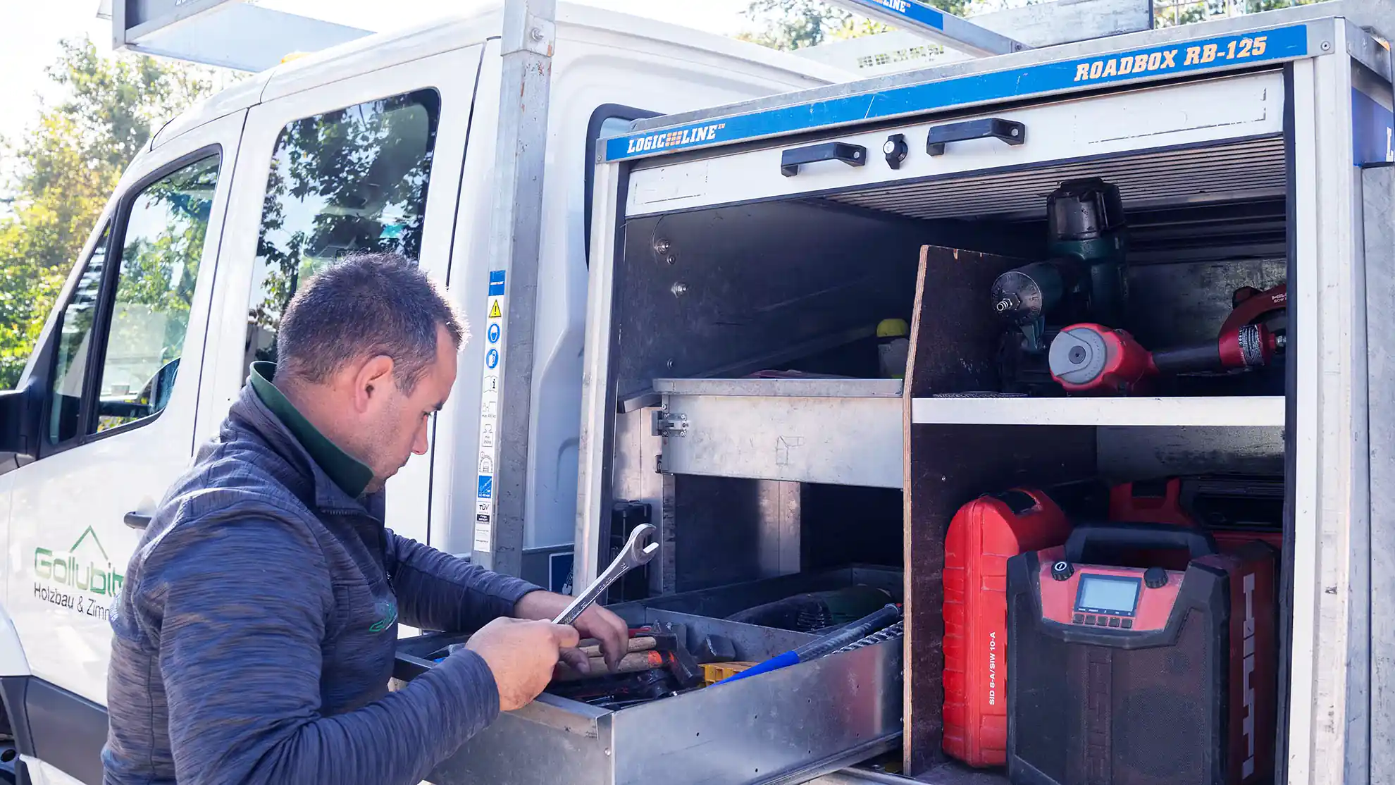 Tools being placed in the RoadBox pull-out drawer